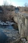 [JAN] "Gunk" frozen in ice sheet under bridge over Fall Brook Cr. (2)